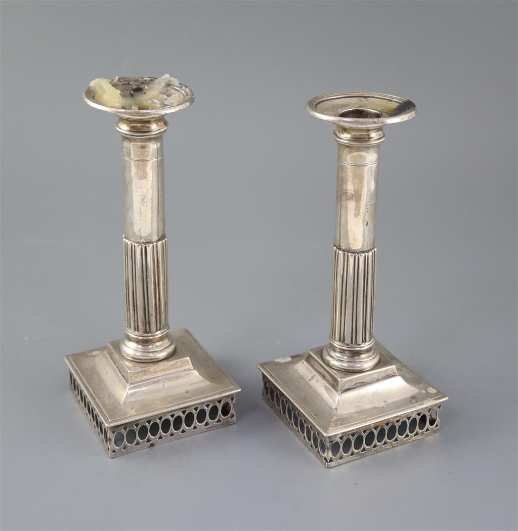 A pair of early 19th century Spanish silver candlesticks, c.1800, ships bases